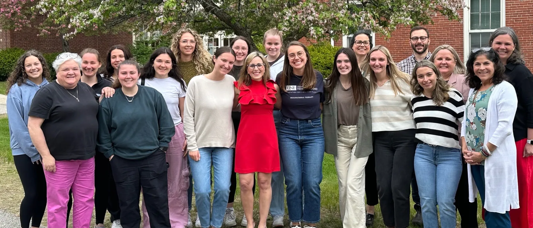 AOTA President Alyson Stover poses with students and faculty from UNE’s Department of Occupational Therapy