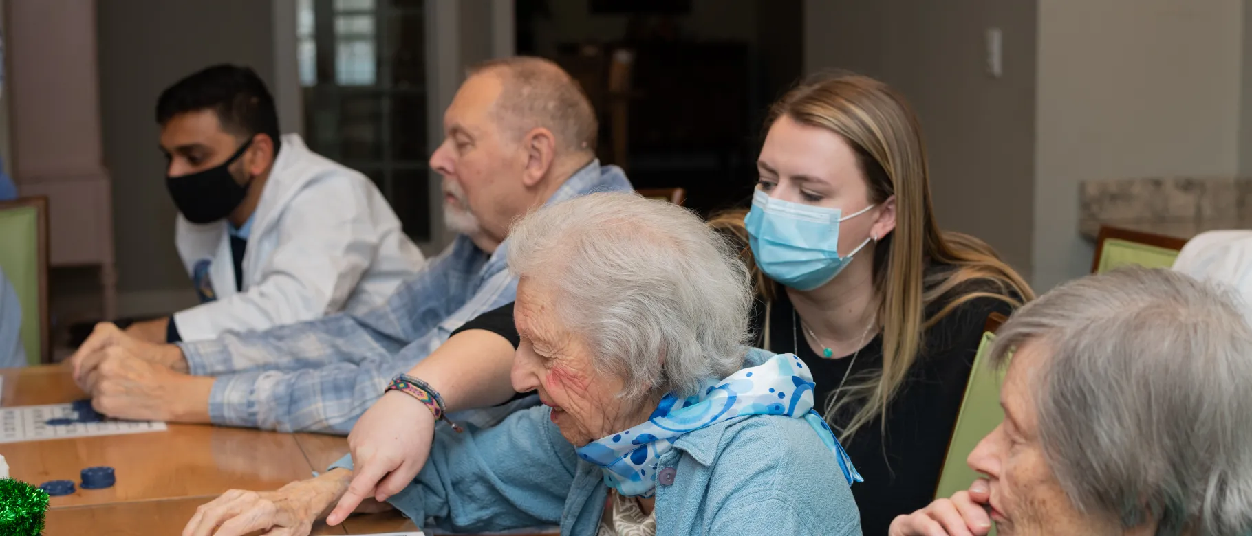 UNE health professions students play bingo with seniors at an assisted living facility