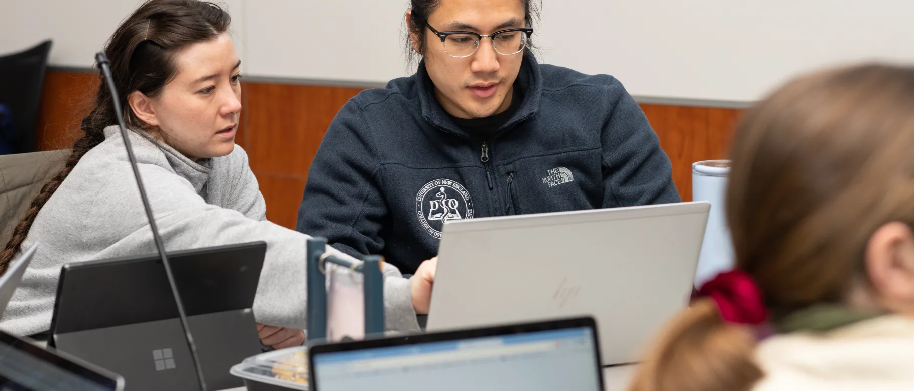 UNE COM students study in groups in Leonard Hall