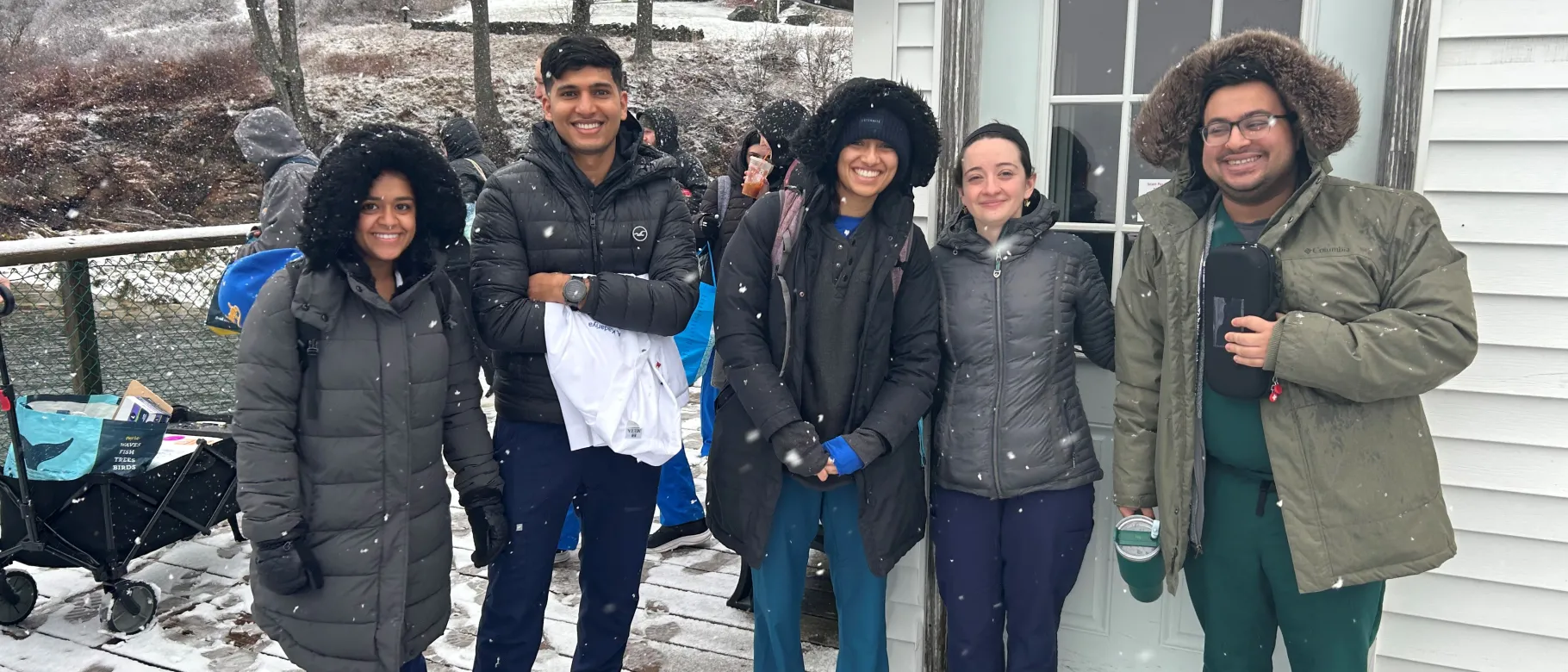 UNE students pose in the snow on Chebeague Island