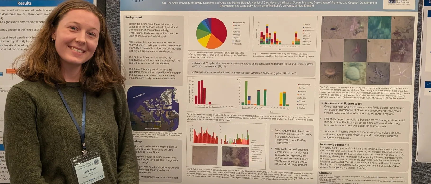 UNE student Lydia Jones poses in front of a research poster