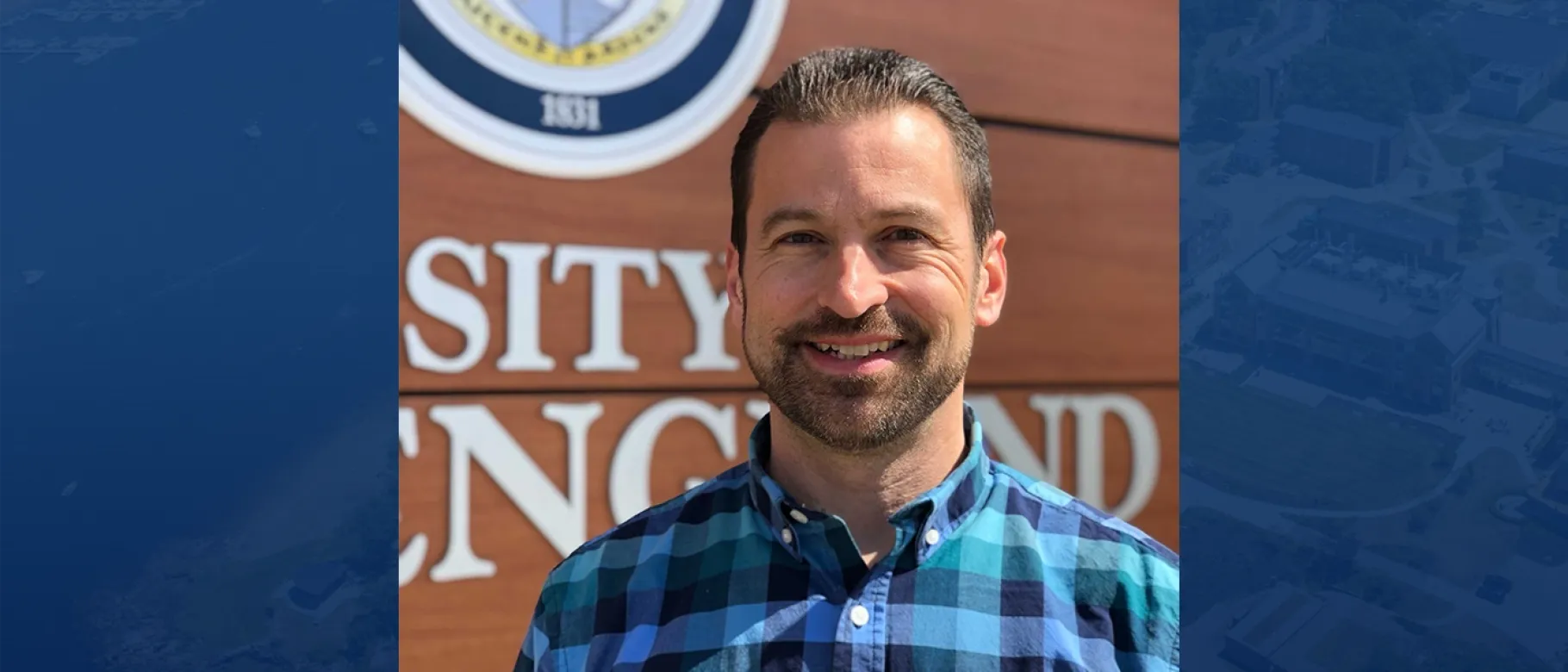 Headshot of Christopher RIzzo against blue background