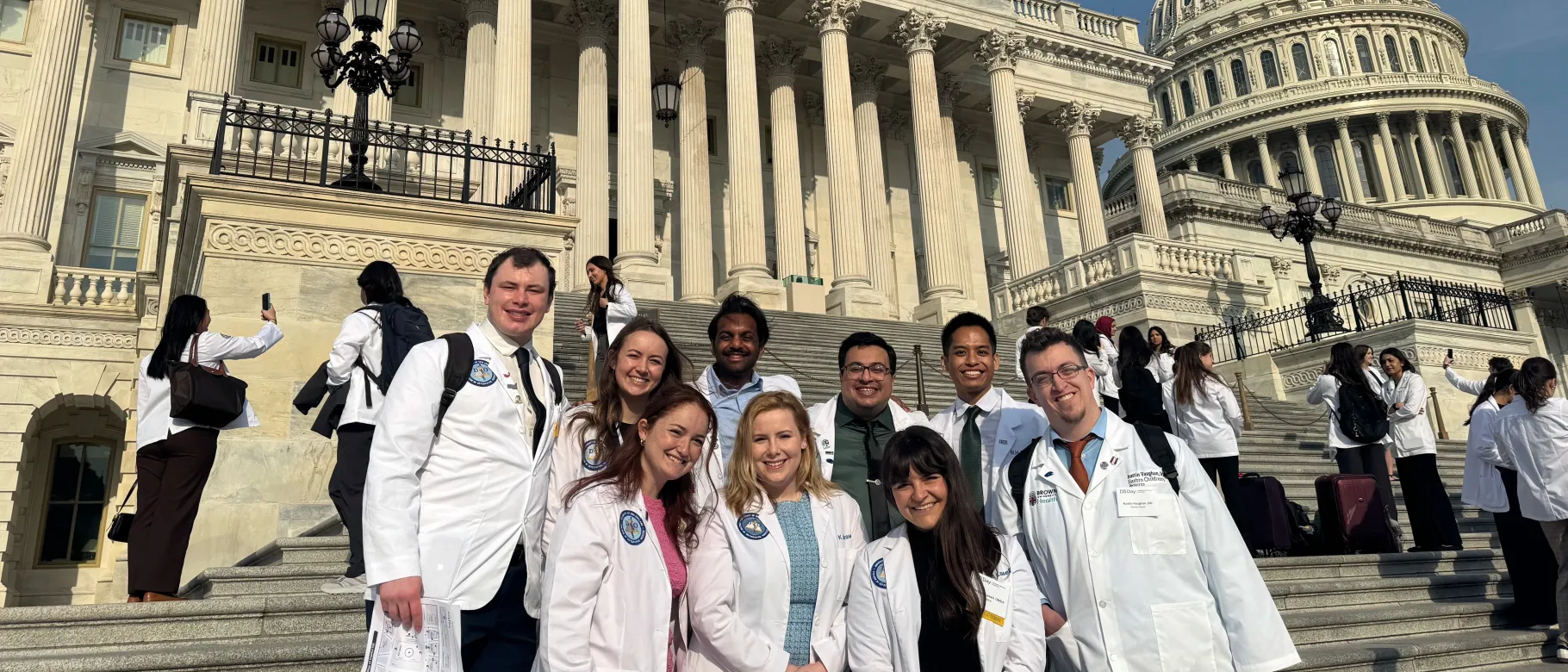 UNE medical students and faculty pose in front of the U.S. Capitol building