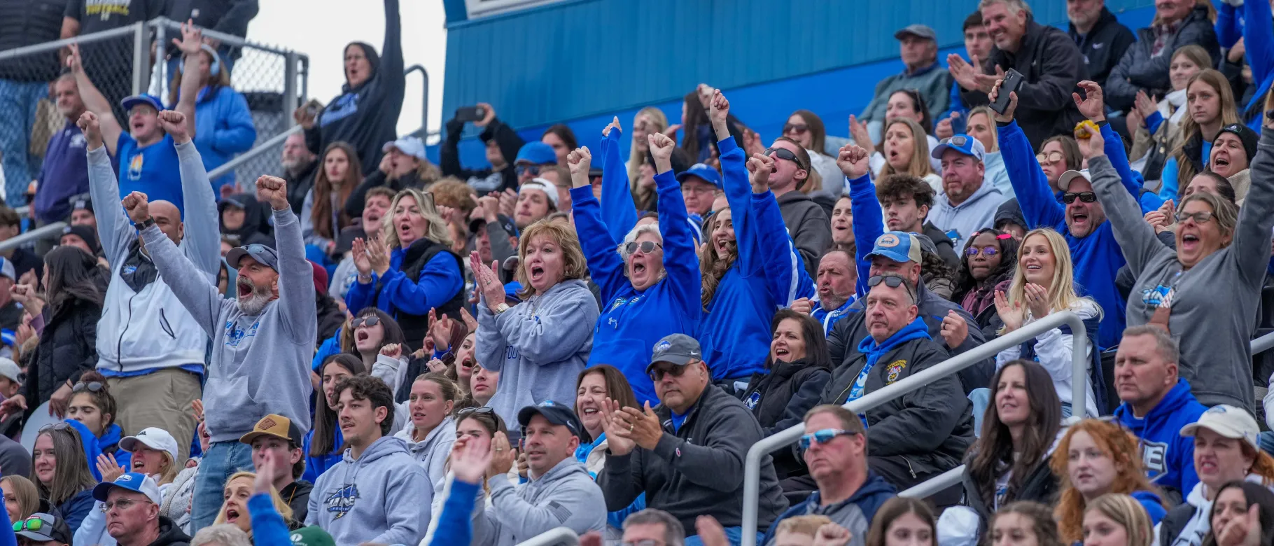 Fans cheer on UNE football in the stands