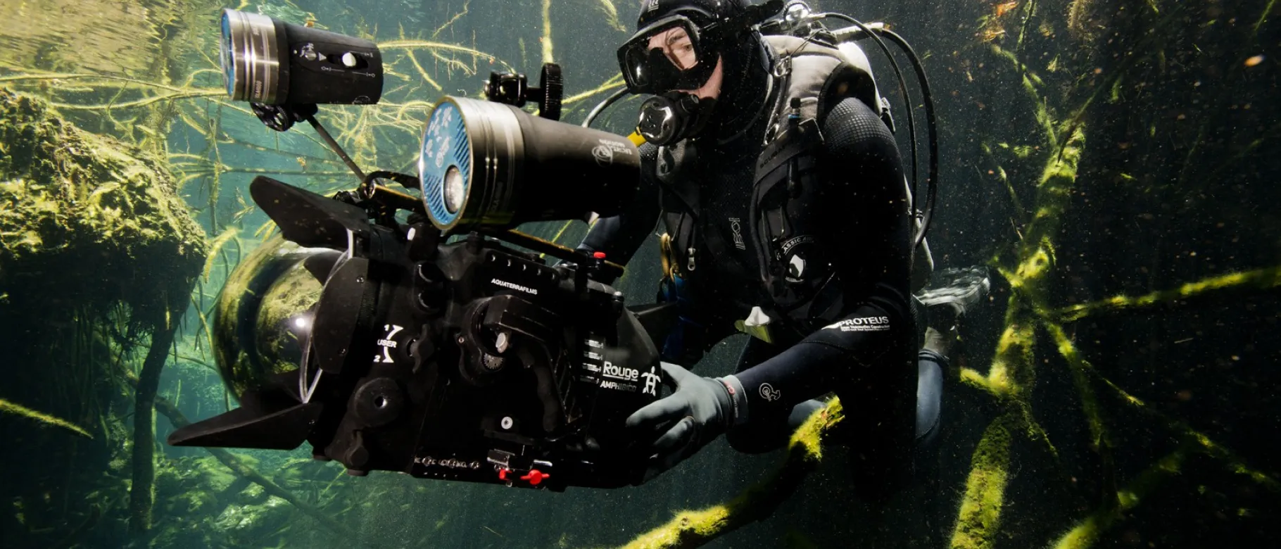 Underwater photo of cinematographer holding camera