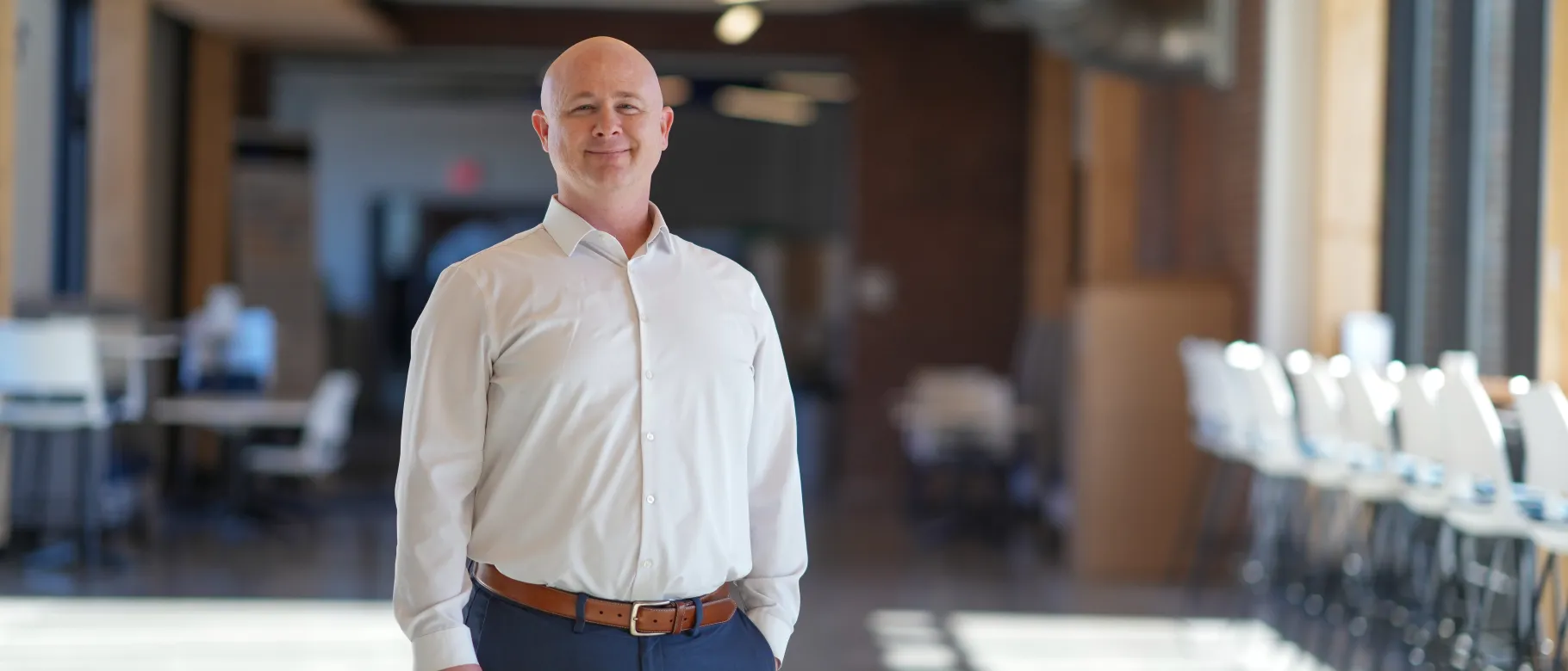 Scott Wood poses in the Harold and Bibby Alfond Center for the Health Sciences