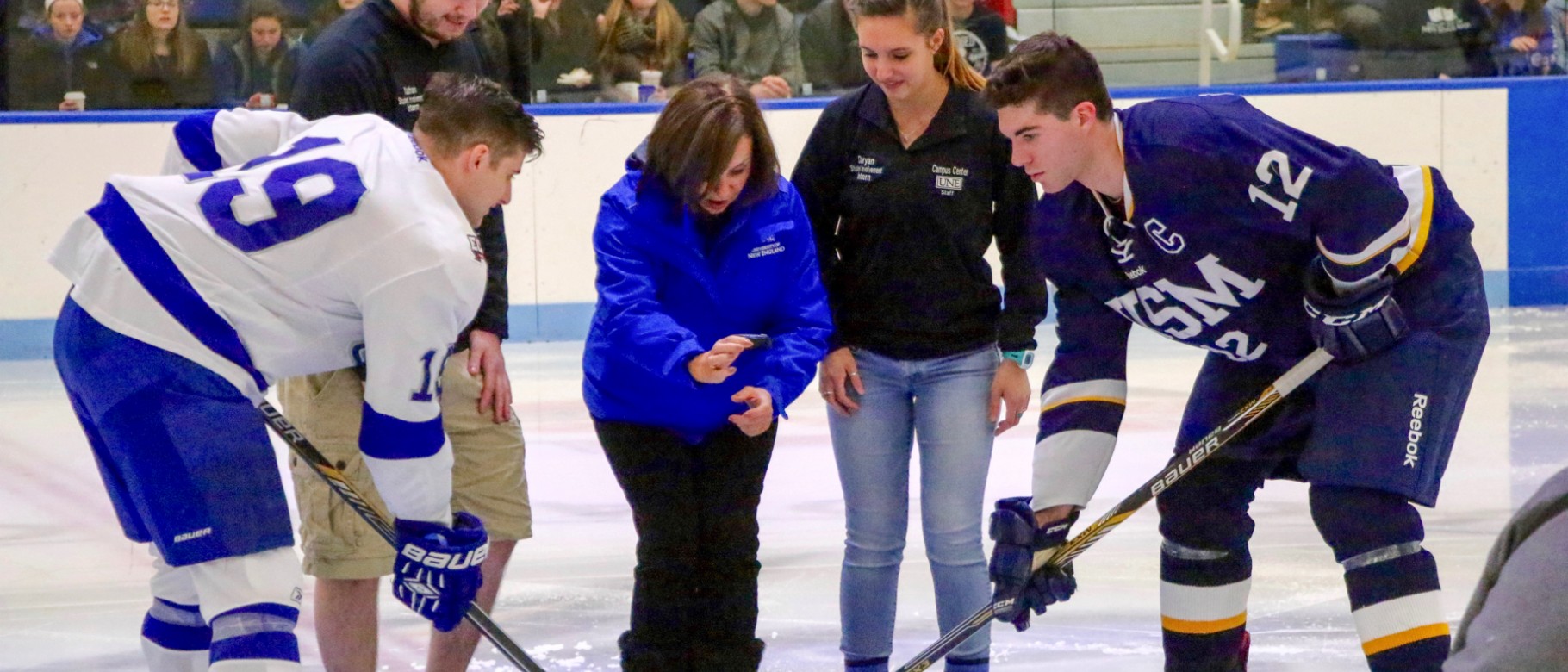 President Danielle Ripich drops the puck at Friday night's hockey game