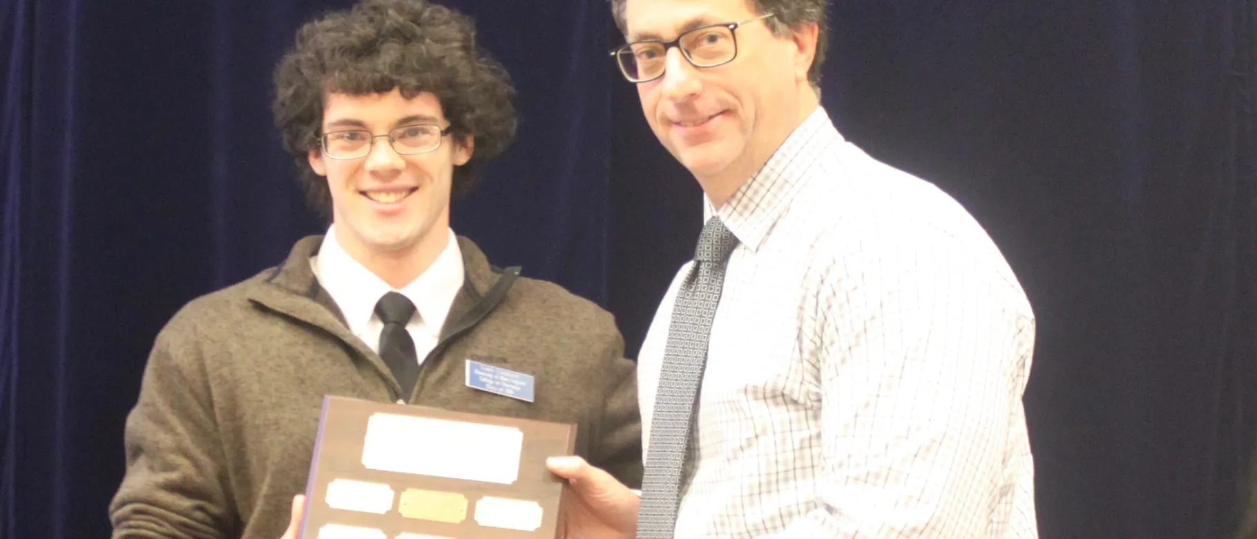 Jeff Nevers accepts Lisa Pagnucco Interprofessional Service Award