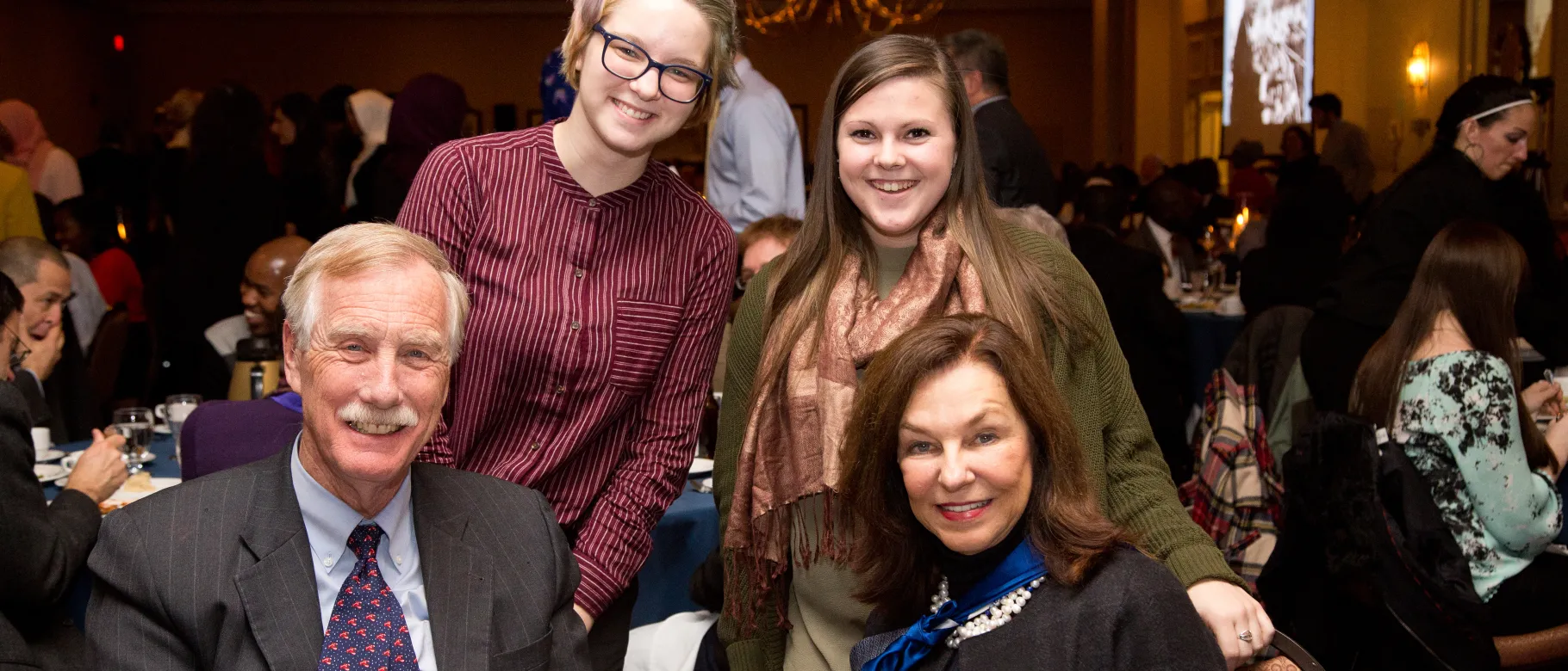 Senator Angus KIng and UNE President Danielle Ripich with students Halie Pruitt (left) and Sarah Schilke at the Maine NAACP's A