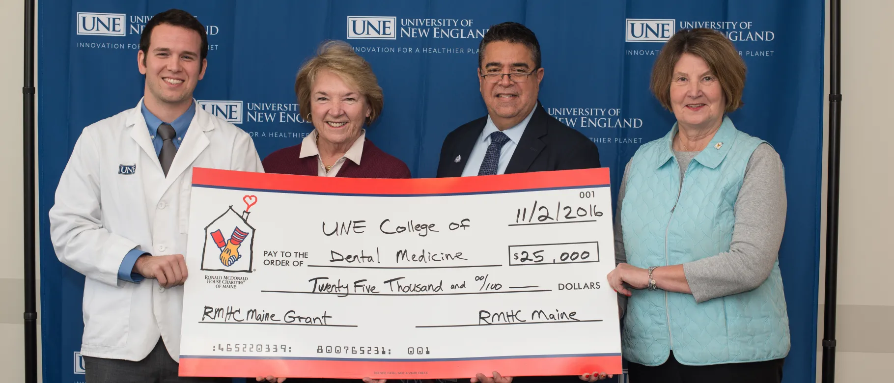UNE College of Dental Medicine student William Fenn; Sheila Peabody, community volunteer for Ronald McDonald House Charities of