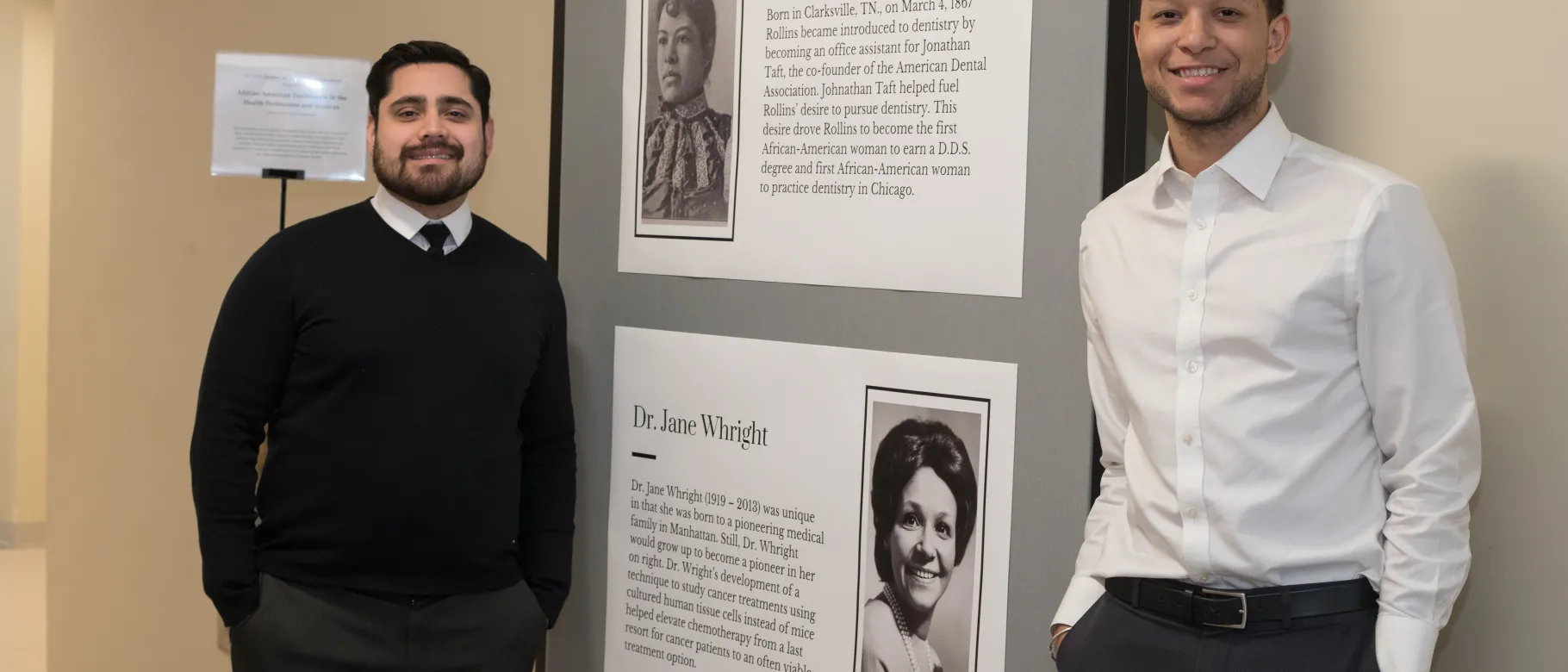 John Contreras and Brandon Barnett in front of the Black History Month display in Innovation Hall