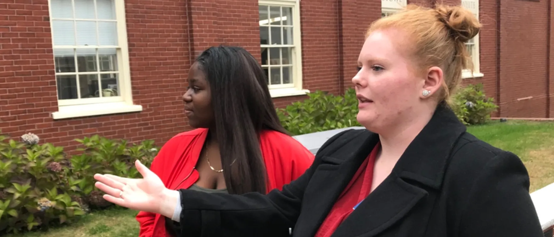 UNE College of Pharmacy student Brianna Gower shows Deering High School student Lea Yere around campus