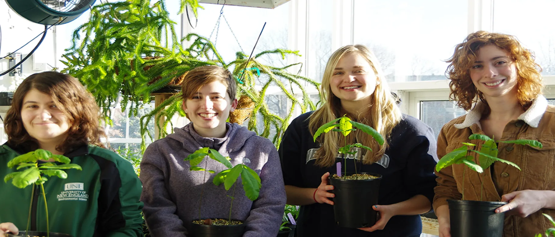 Seniors in UNE’s Department of Environmental Studies Sarah Fleishmann, Kati Hein, Christina Barton and Kat Santarpio with hybrid