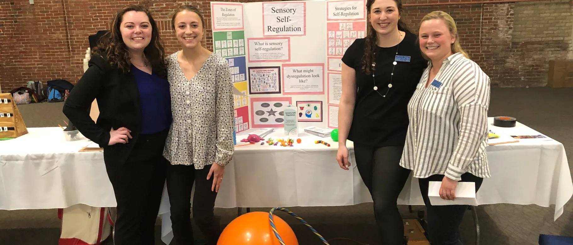 OT students Christina McLaughlin, Emma Robidoux, Kassidy Towne and Hannah Reidman presented on sensory approaches at the Autism
