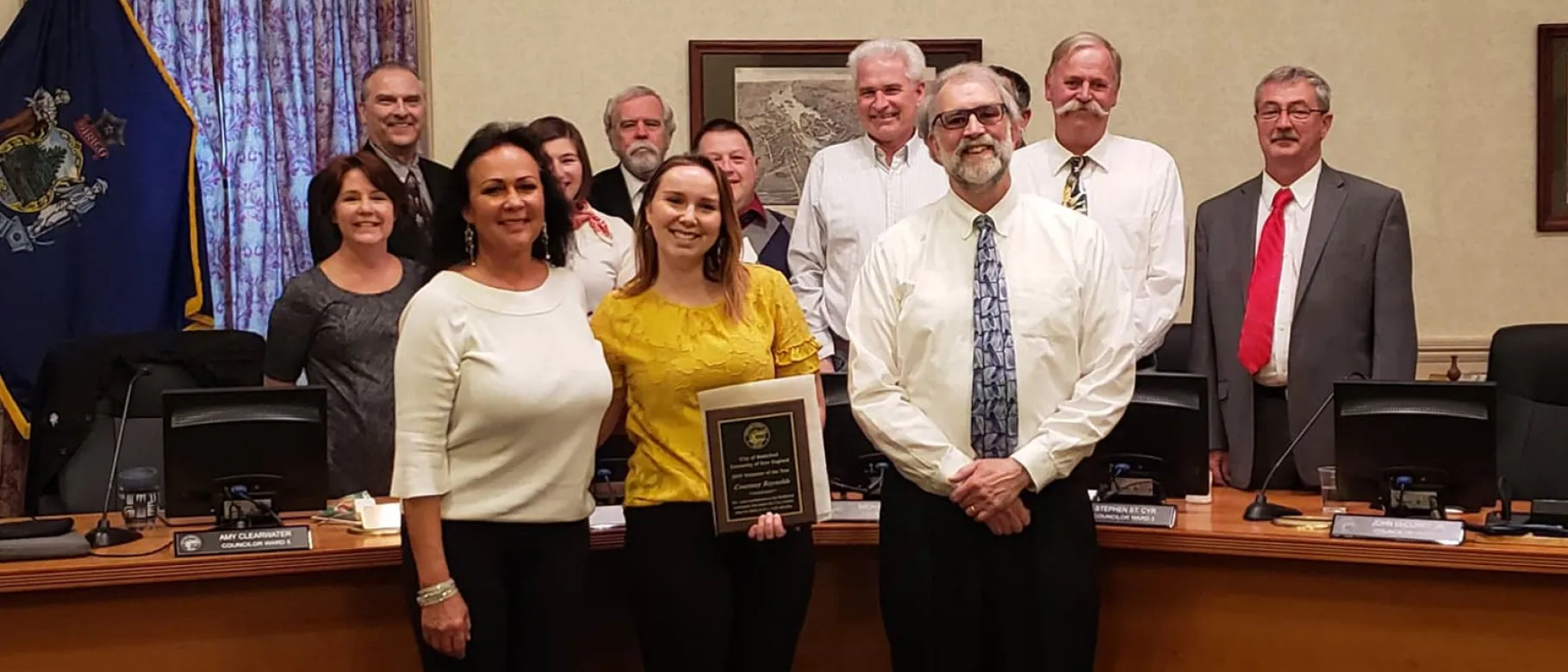 Courtney Reynolds ’19 with her mother, Mayor Casavant, and members of the Biddeford City Council