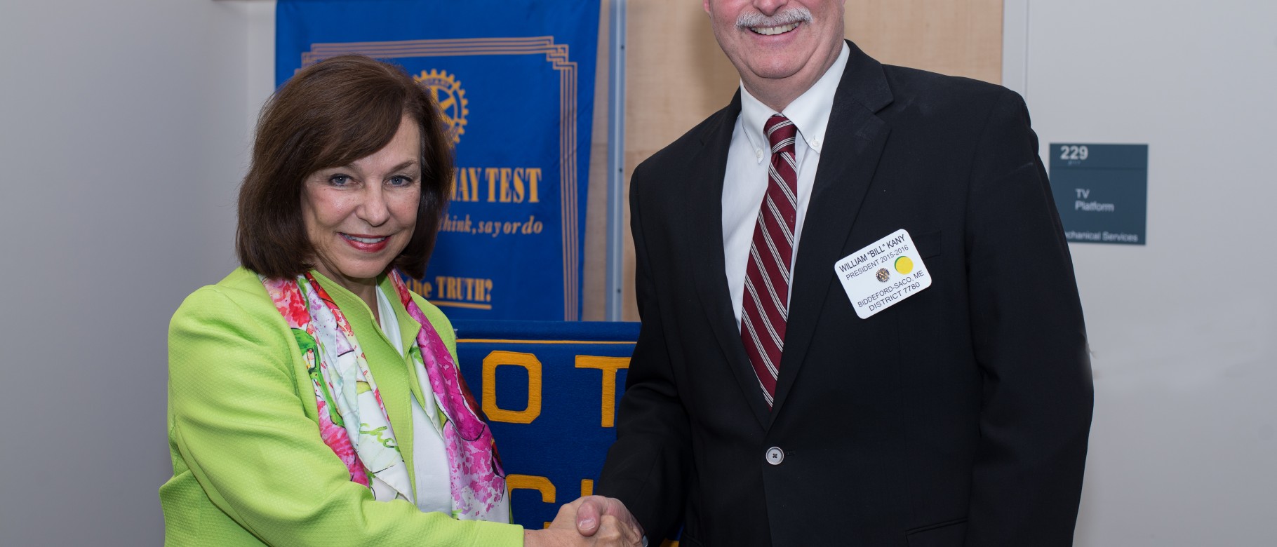 UNE President Danielle Ripich greets Bill Kany, president of the Biddeford-Saco Rotary Club.