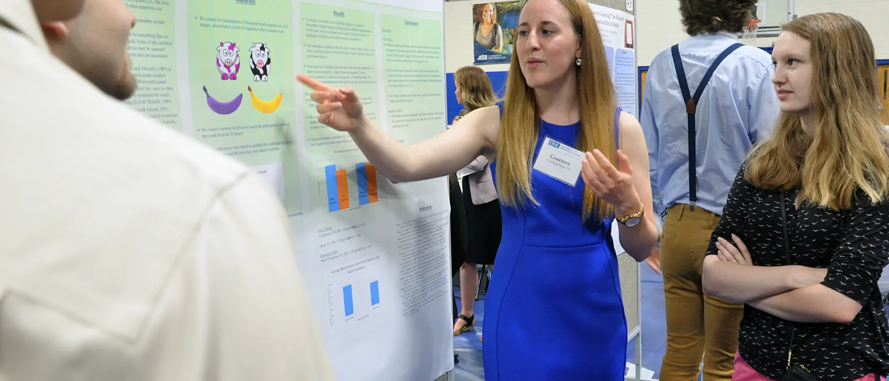 Courtney Parent '19 explains the research on her team's poster