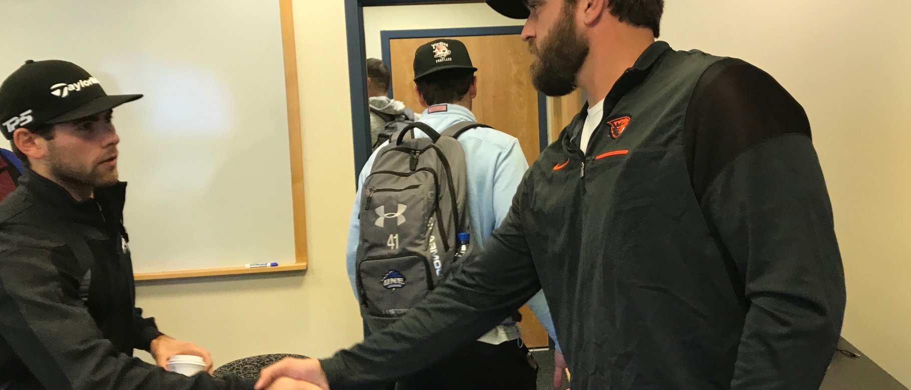 San Francisco Giants pitcher Josh Osich greets UNE students after class