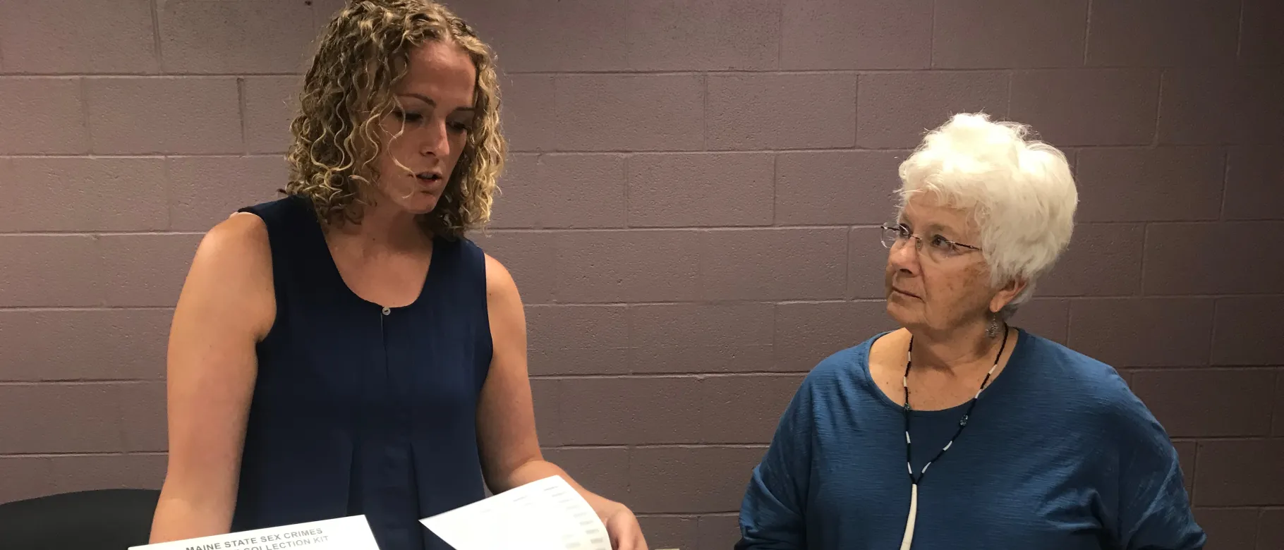 Regional coordinator of the UNE SANE program Emily Hilton and Polly Campbell with the sexual assault kit forensic nurses use 