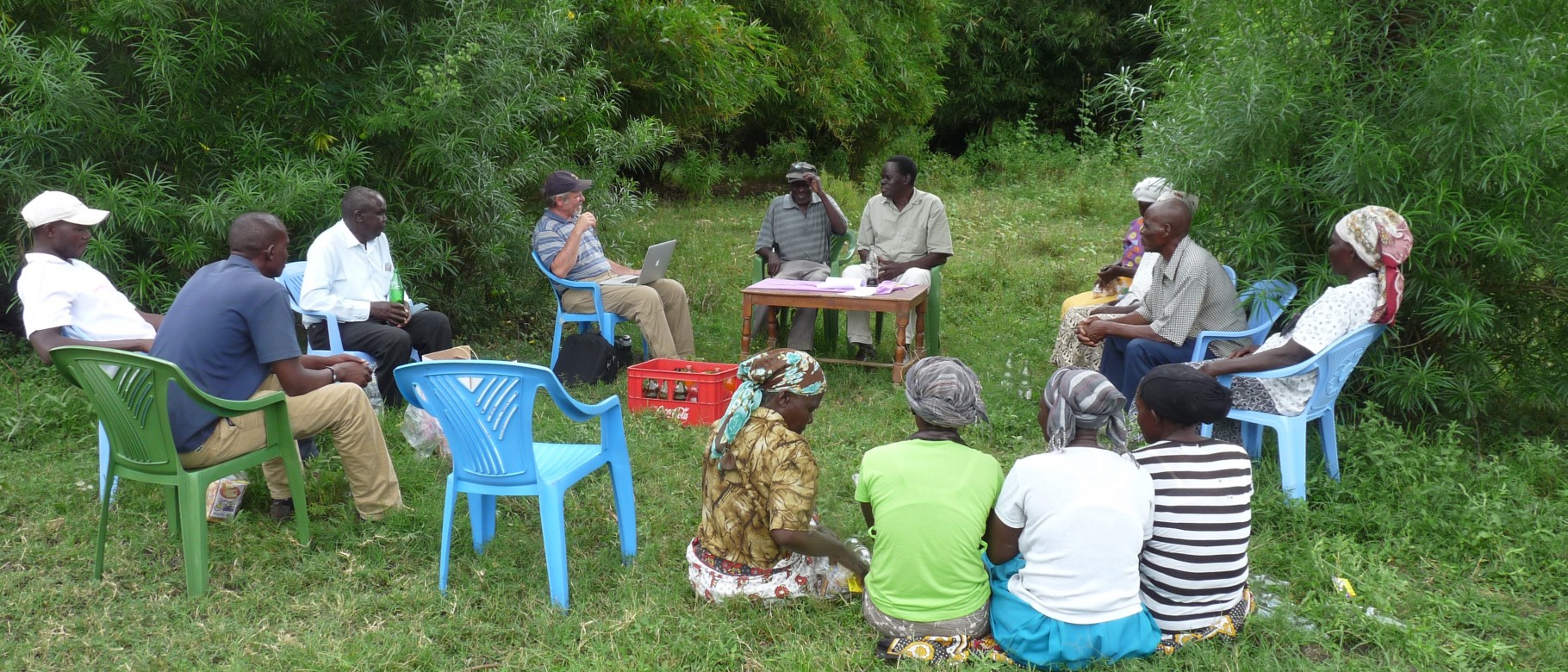 Rick Peterson (left of center table) and one of his Kenyan co-authors Peter Nyabua (center table, right) conduct a focus group w