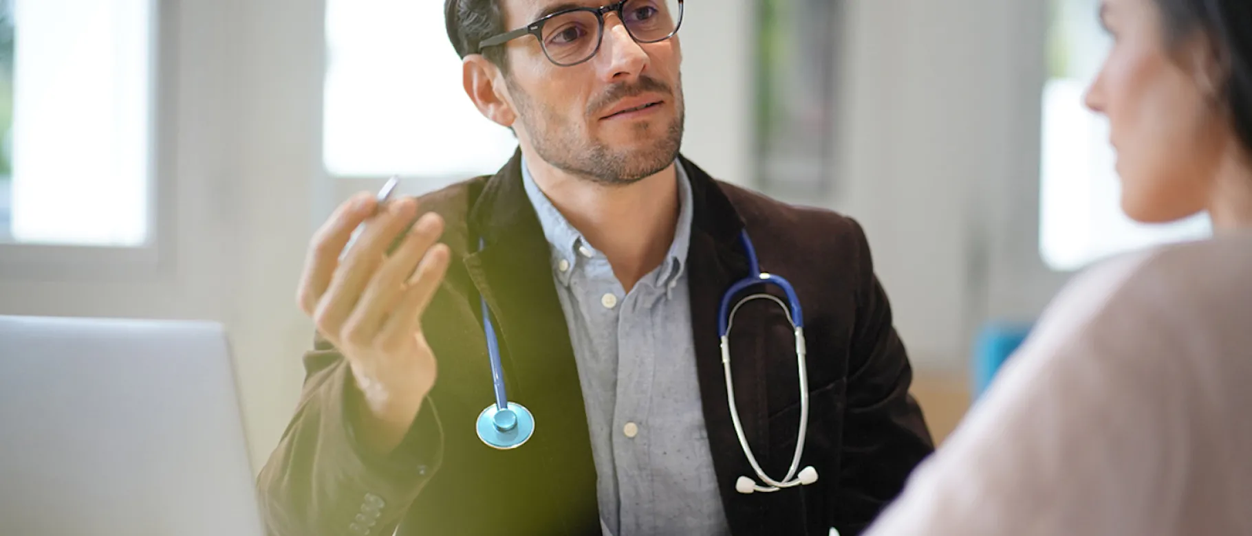 Male doctor with patient