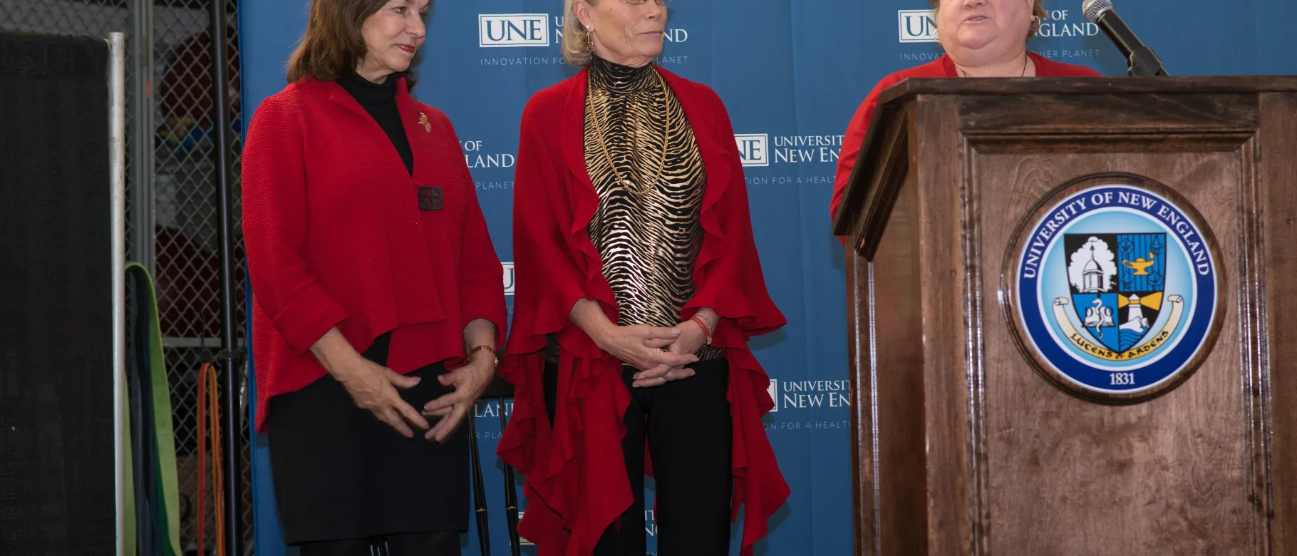 Judy Kimball is recognized by UNE President Danielle Ripich and Occupational Therapy Director Kris Winston