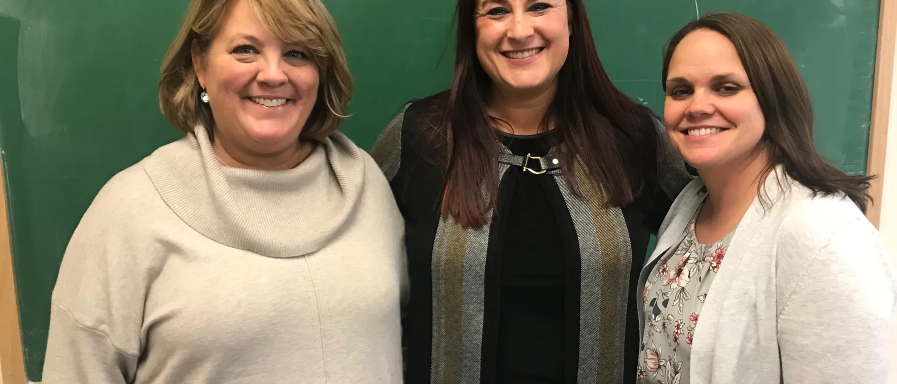 Krysten Gorrivan with Maine Teacher of the Year Heather Whitaker and Brooke Proulx of UNE's Master of Social Work program