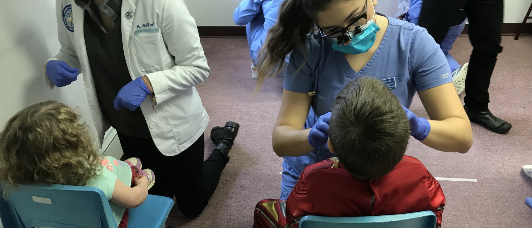 Students from UNE COM and the WCHP provide oral health screenings at the Brunswick Head Start, Oct. 31, 2019.
