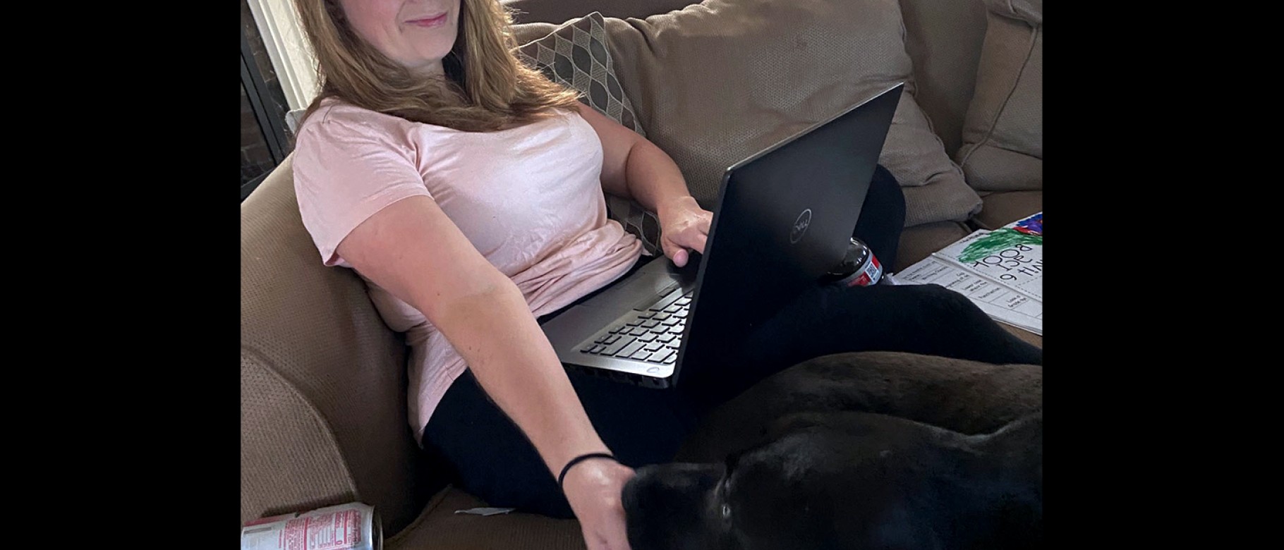 Meghan May, Ph.D., UNE professor of microbiology, hunkers down at home to work. With a little help from dog Rosie, she provides 