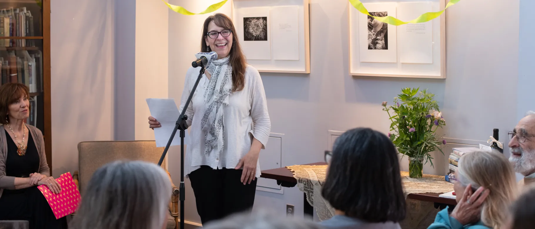 MWWC Director Jennifer Tuttle addresses the audience at the 60th anniversary celebration of the Maine Women Writers Collection