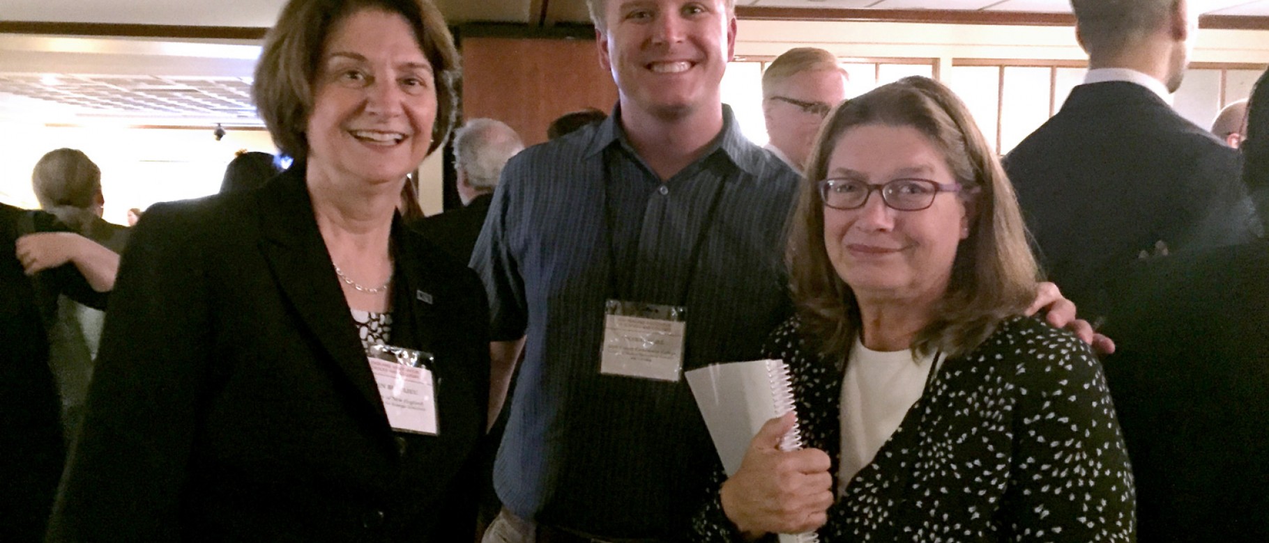 Ellen Beaulieu (left) and Margaret Moremen (right) stand with Nick Gill (colleague from York County Community College and recent