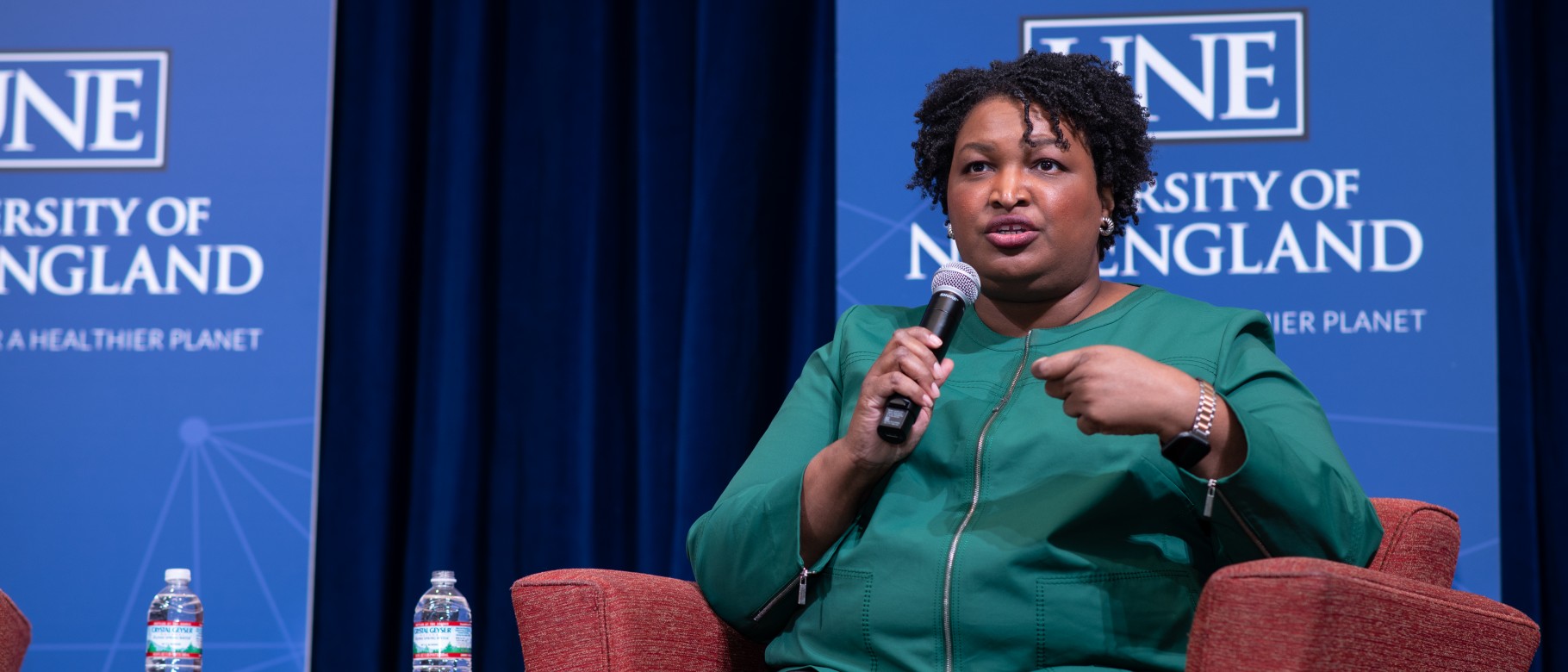 Stacey Abrams seated on stage