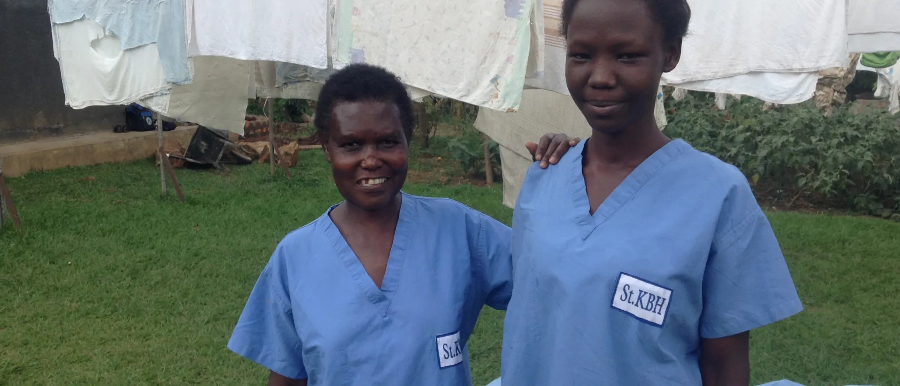 Health workers in Uganda wear scrubs donate by UNE medical students