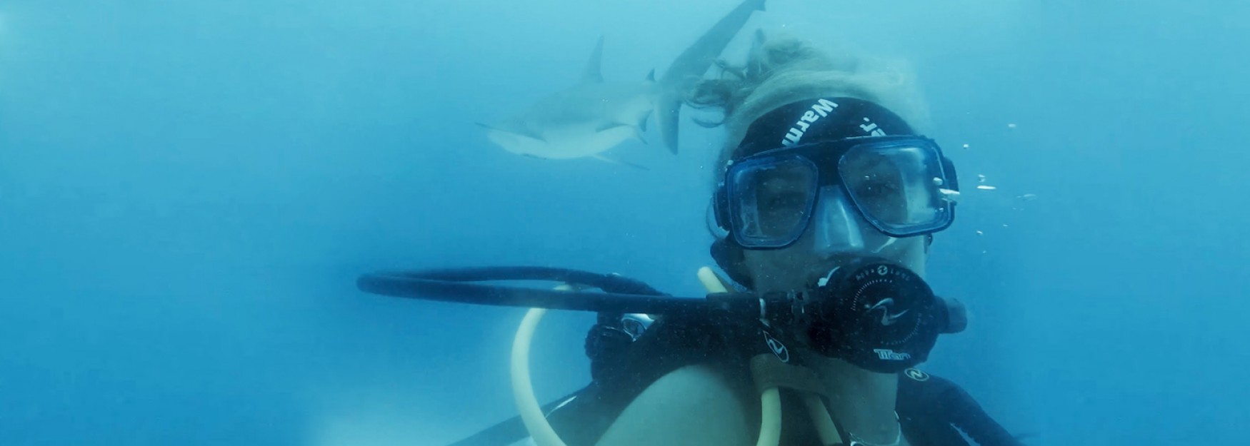 u n e marine science student Katie Dimm poses underwater in full scuba gear