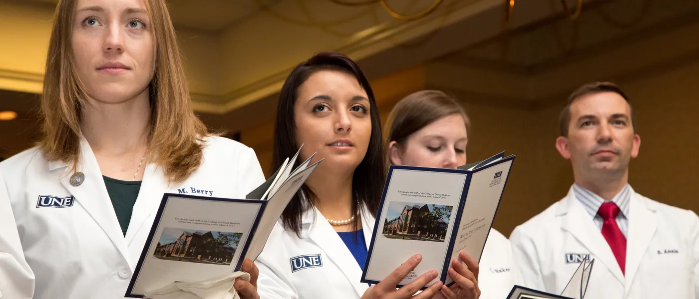 Dental Medicine student stand together at the White Coat Ceremony
