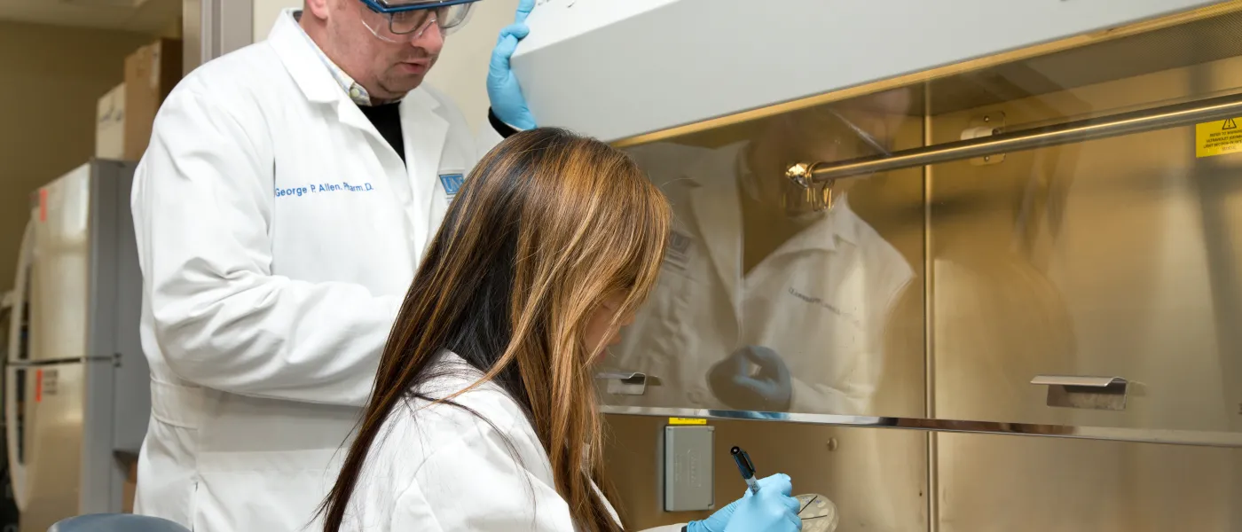 U N E College of Pharmacy student at lab bench