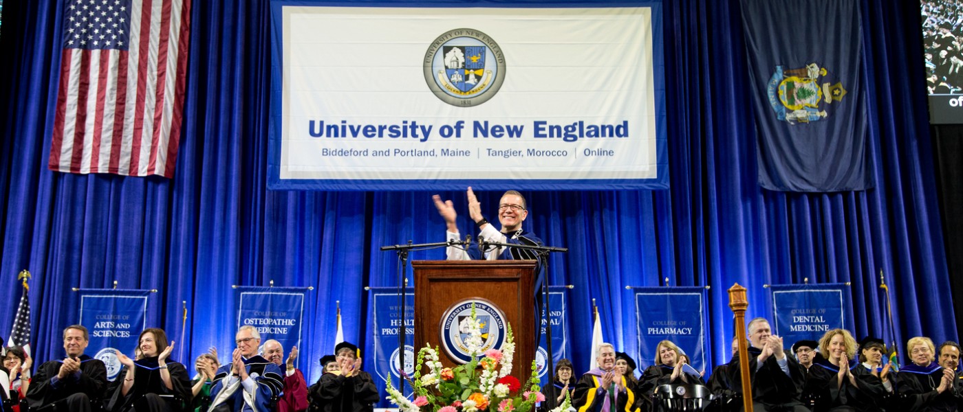 President Herbert applauds the graduating class at commencement