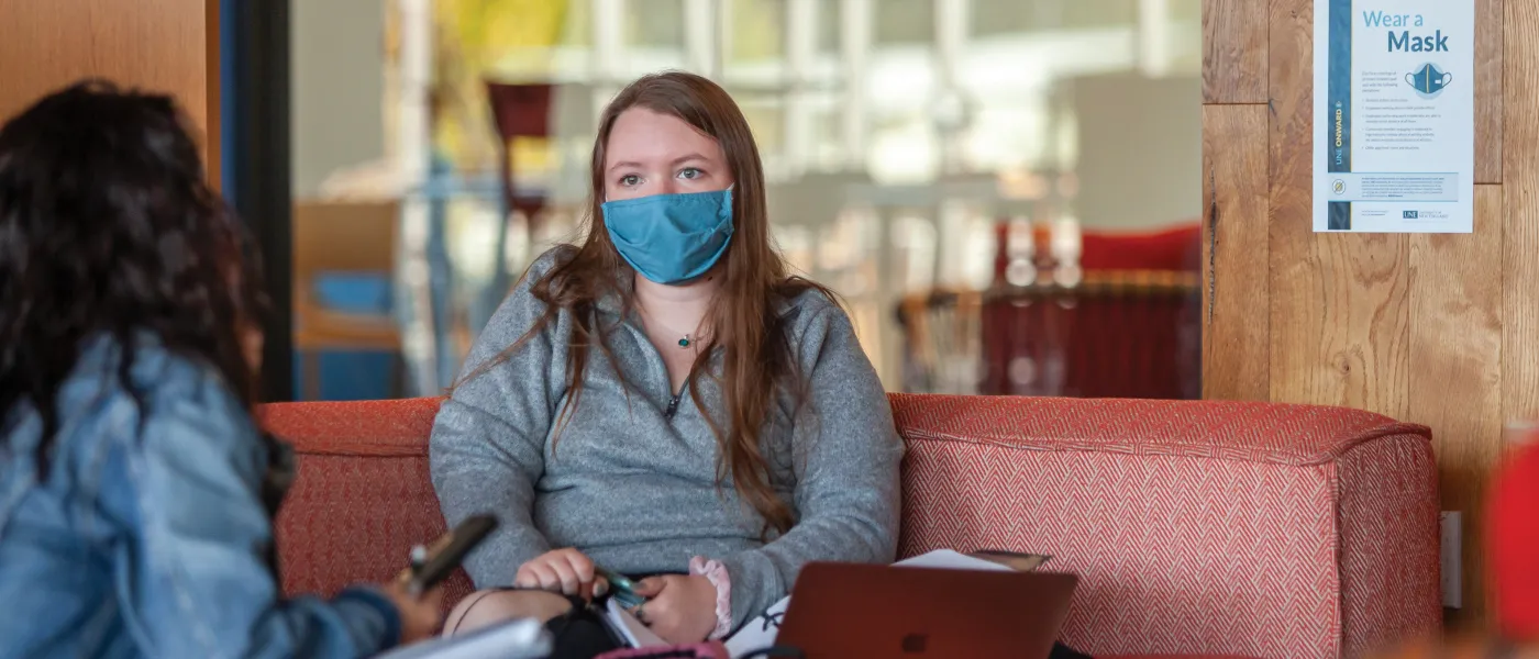Students wearing masks and social distancing