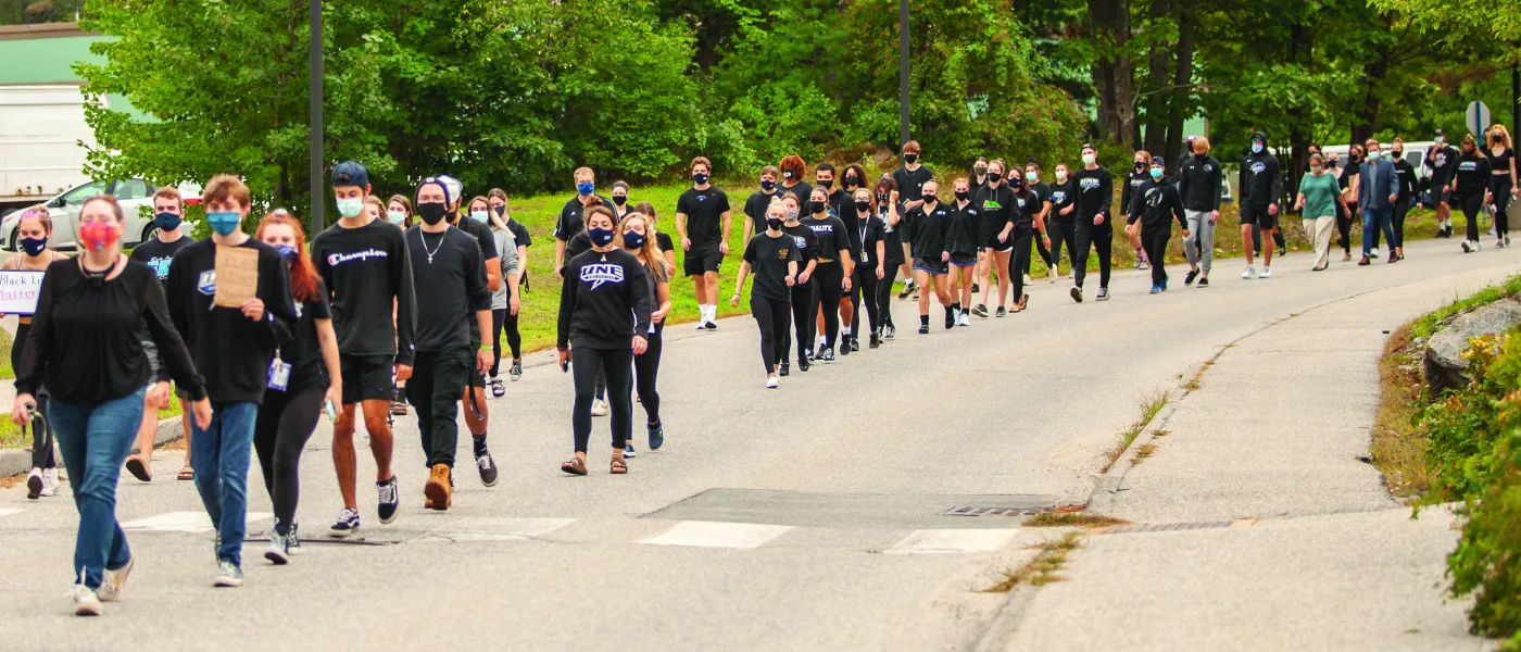 students and employees participate in the march for social justice held on the biddeford campus