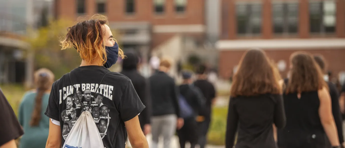 students participate in the march for social justice held on the biddeford campus