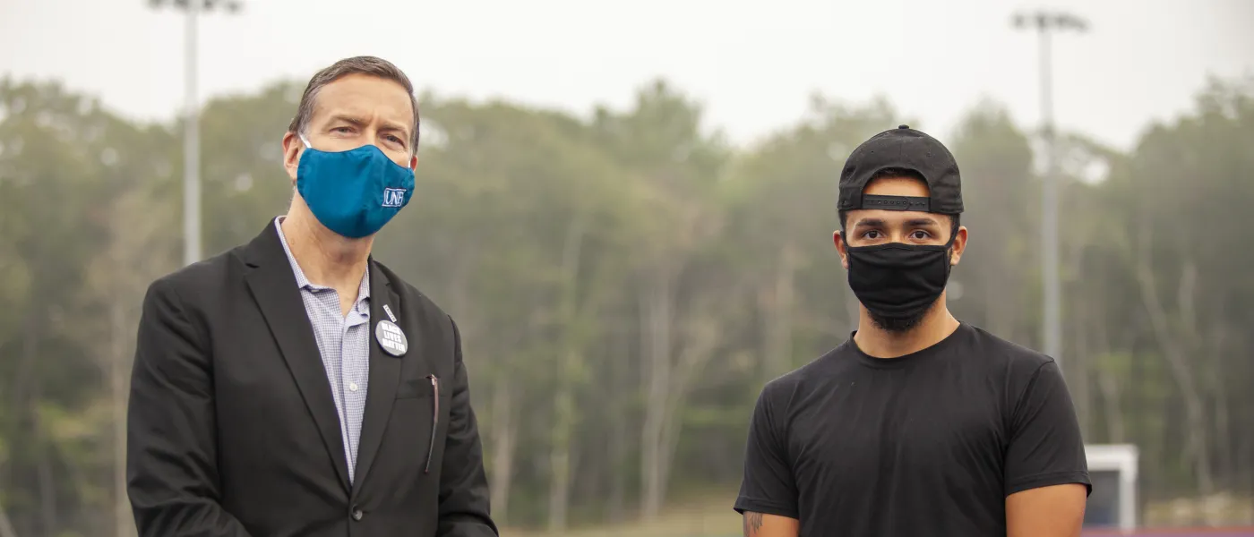president herbert poses with julian connerton, one of the students who organized the march for social justice