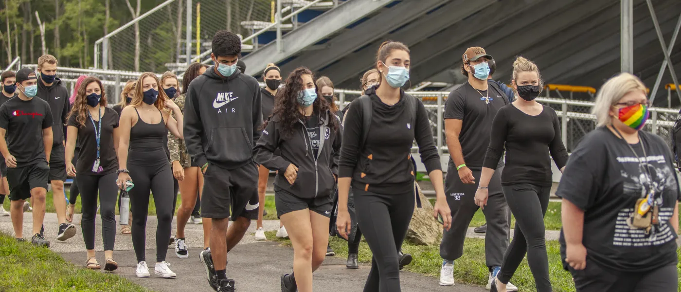 students walk in the march for social justice held on the biddeford campus