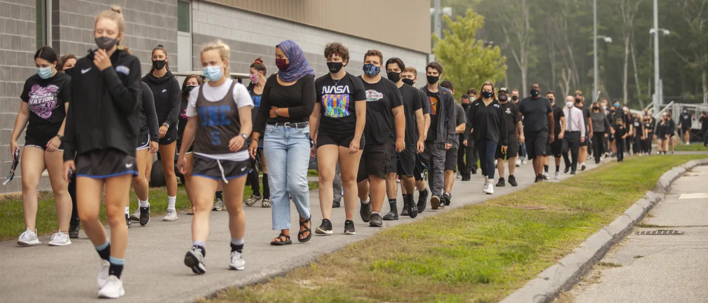 students walk in the march for social justice held on the biddeford campus
