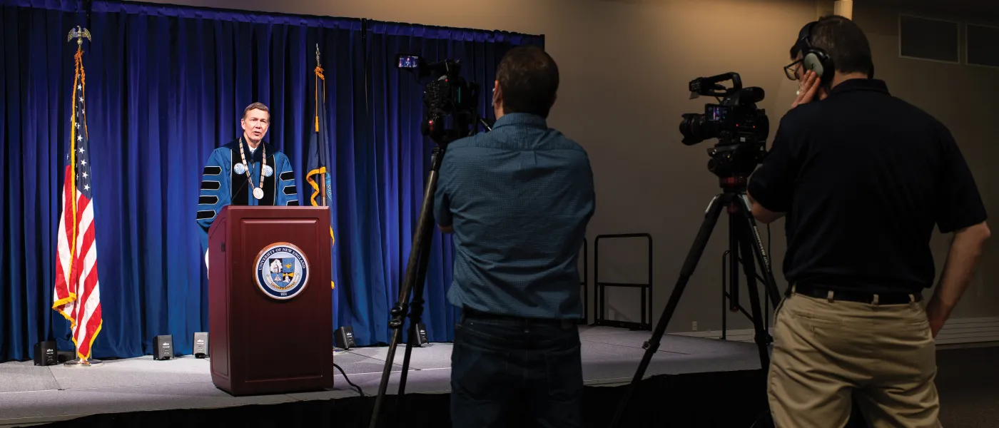 U N E President James D. Herbert, Ph.D., addresses graduates in taped remarks ahead of the COM Commencement.