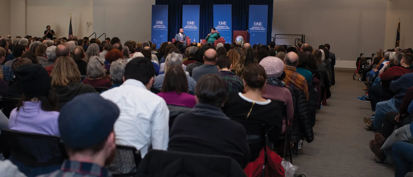 Abrams and Johnson address the standing-room-only crowd in Innovation Hall.
