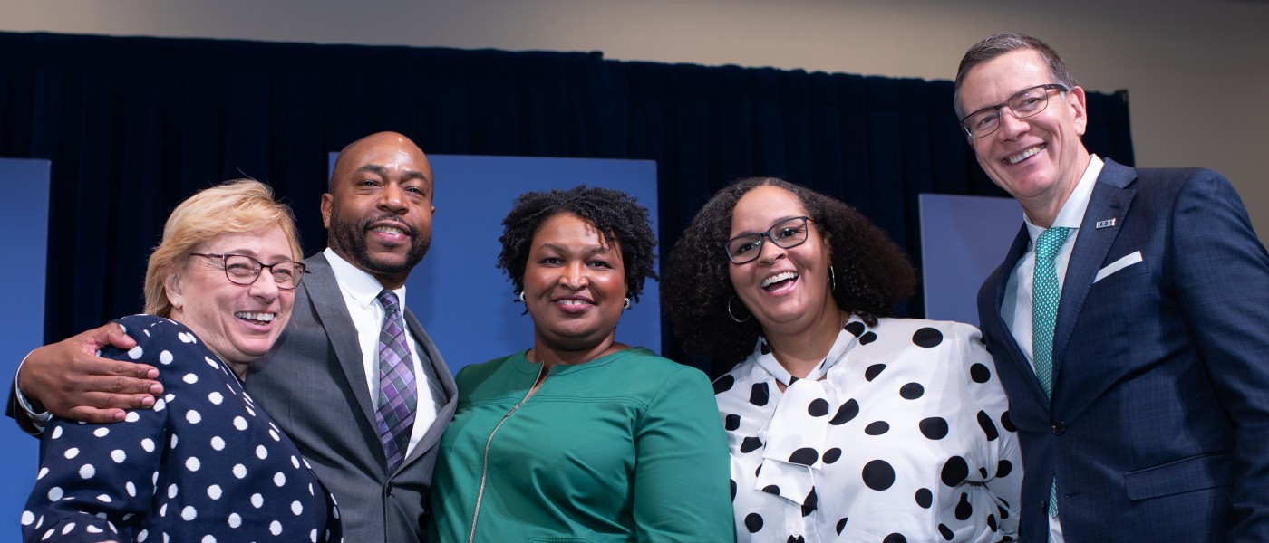 Stacey Abrams poses with Maine Governor Janet Mills, Dr. Theodore R. Johnson, Director of Intercultural Student Engagement Erica Rousseau, and UNE President James Herbert