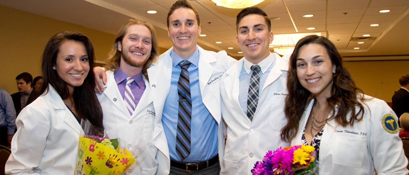 Physician Assistant degree program students at white coat ceremony.