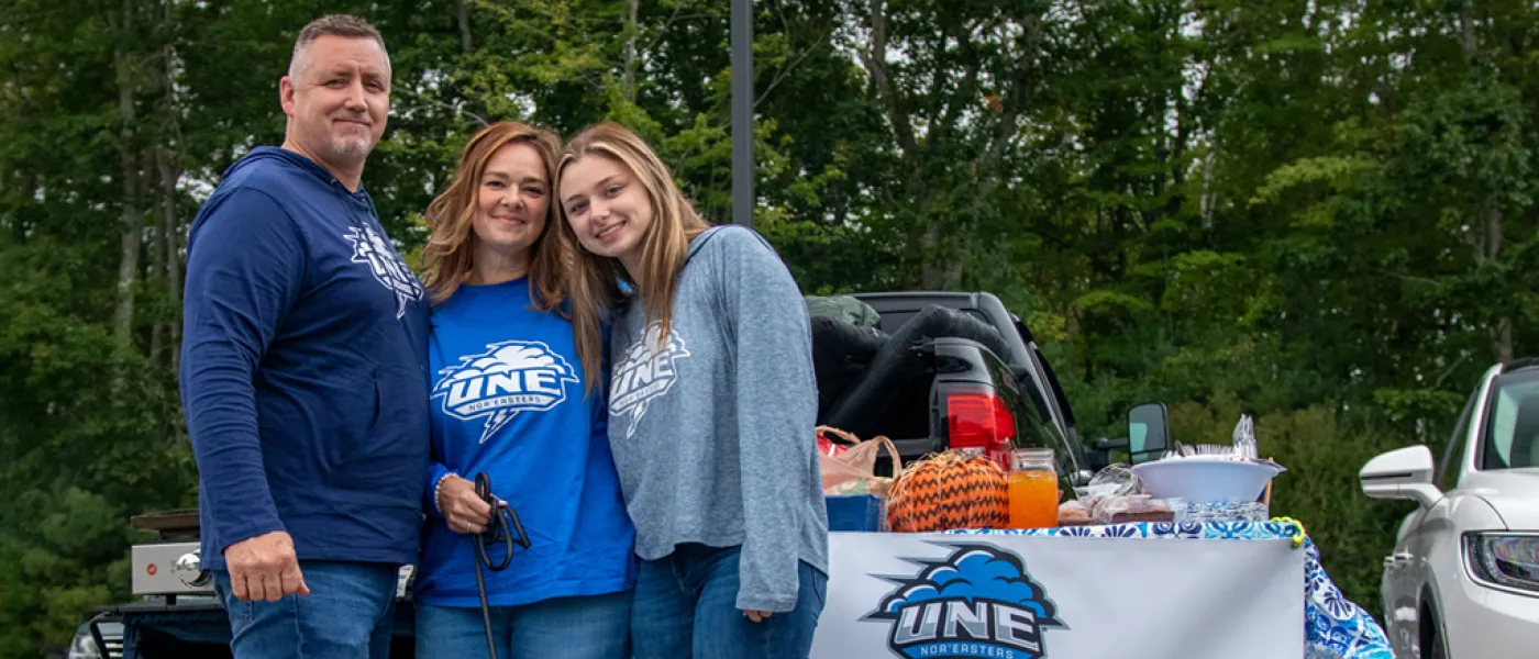 U N E student and their family at a tailgate