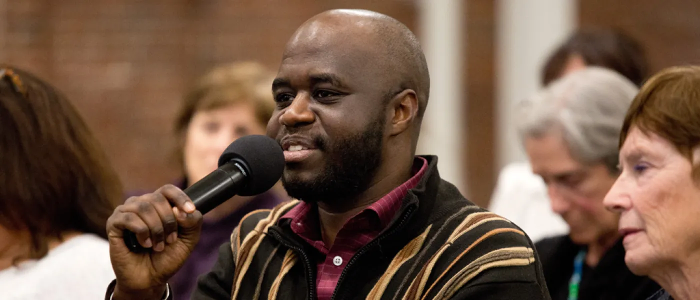 Person asking a question at a Center for Global Humanities event