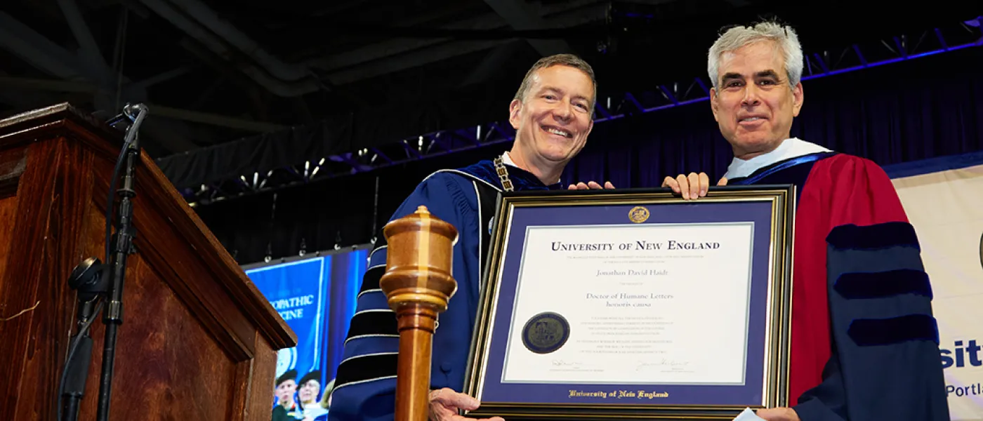 UNE President James Herbert presents an honorary degree to Jonathan Haidt